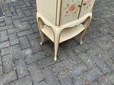 A pair of antique Italian hand painted bedside cabinets