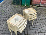 A pair of antique French hand pained bedside cabinets