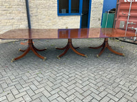 Vintage English Mahogany Three Pillar Table and Sixteen Chairs