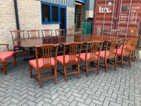 Vintage English Mahogany Three Pillar Table and Sixteen Chairs