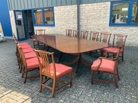 Vintage English Mahogany Three Pillar Table and Sixteen Chairs