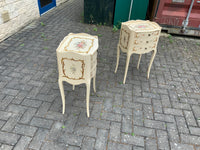 A pair of antique French hand painted bedside cabinets