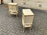 A pair of antique Italian hand painted bedside cabinets