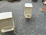 A pair of antique Italian hand painted bedside cabinets