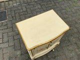 A pair of antique Italian hand painted bedside cabinets