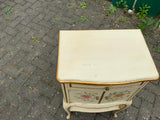 A pair of antique Italian hand painted bedside cabinets