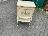 A pair of antique Italian hand painted bedside cabinets