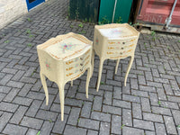 A pair of antique French hand pained bedside cabinets