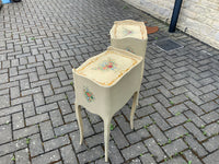 A pair of antique French hand pained bedside cabinets