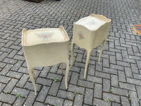 A pair of antique French hand pained bedside cabinets