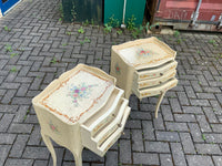 A pair of antique French hand pained bedside cabinets