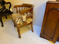 Antique French walnut framed upholstered tub armchair