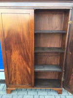Brown Cupboard with open door revealing shelves