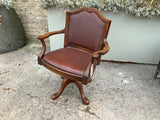 Antique mahogany swivel and reclining desk chair